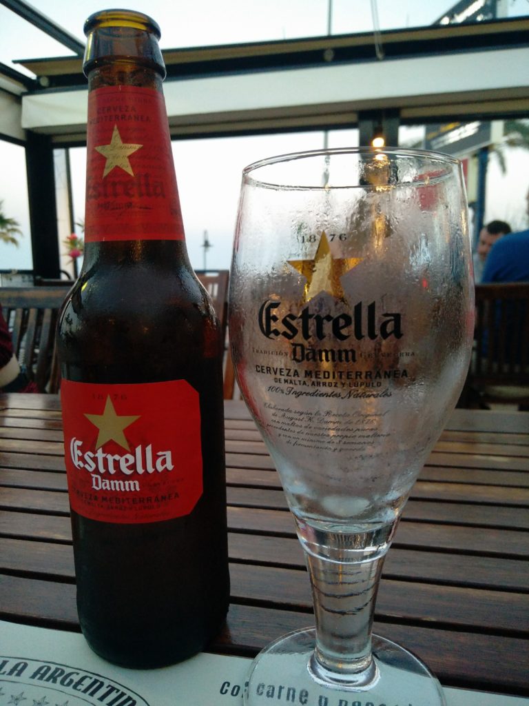 Estrella Damm beer bottle and glass